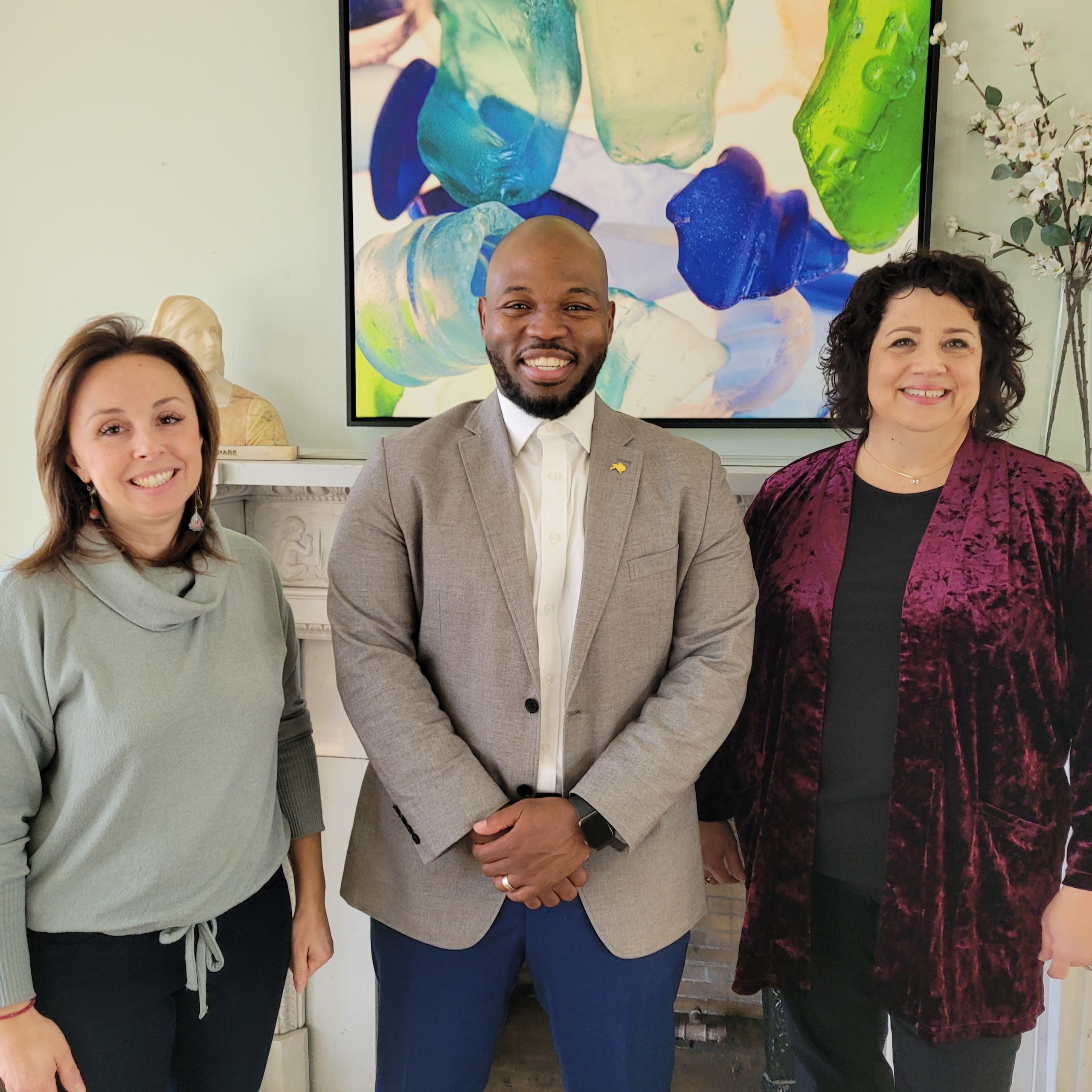 IIB Executive Director, Jennifer Rizzo-Choi standing with Buffalo's Director of the Office of New Americans, Darren Saxon, and Denise Phillips Behag, Director of New American Integration